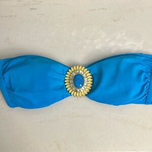 Victoria’s Secret, teal bandeau bikini top with gold medallion. Size medium.